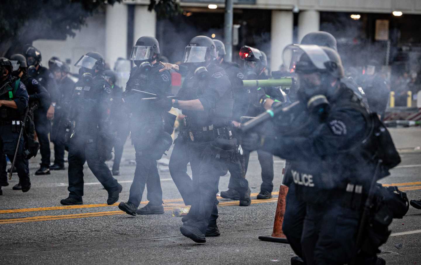 LAPD clear the street outside the Metropolitan Detention Center as demonstrators gather in response to ICE raids in Los Angeles.